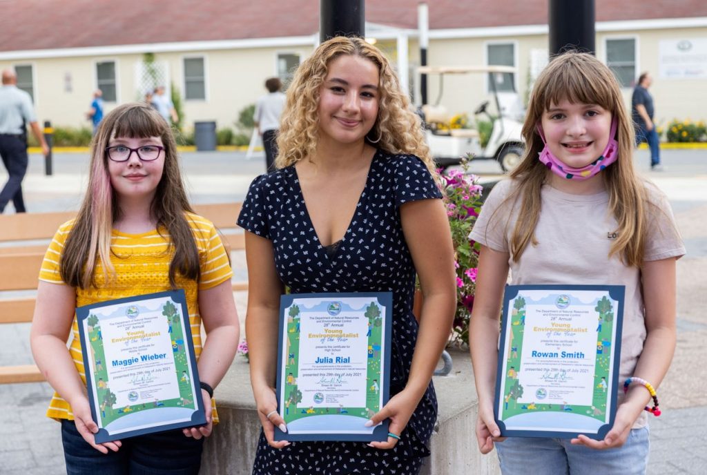 DNREC’s 2021 Young Environmentalists, Maggie Wieber, Julia Rial and Rowan Smith pose with their certificates.